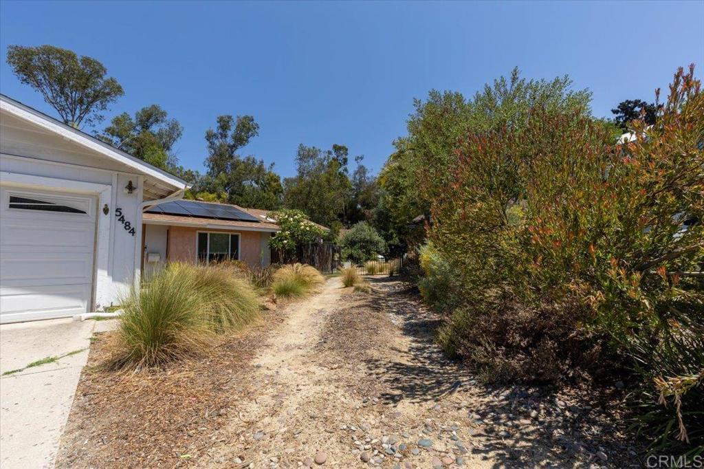 5488 New Mills Road San Diego, CA 92115 - Photo 15 of 17 a view of a house with a yard