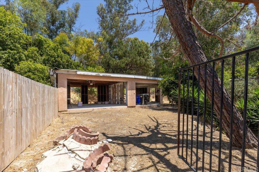 5488 New Mills Road San Diego, CA 92115 - Photo 3 of 17 a front view of a house with a patio