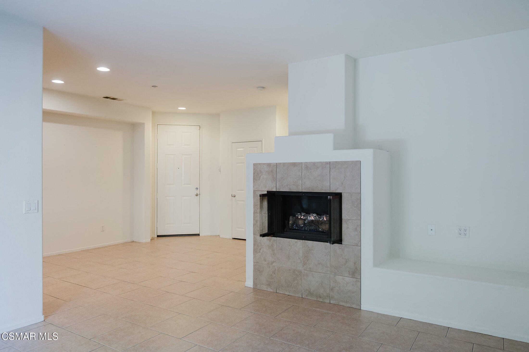 1454 Patricia Avenue, Unit 402 Simi Valley, CA 93065 - Photo 15 of 50 a view of an empty room with a fireplace