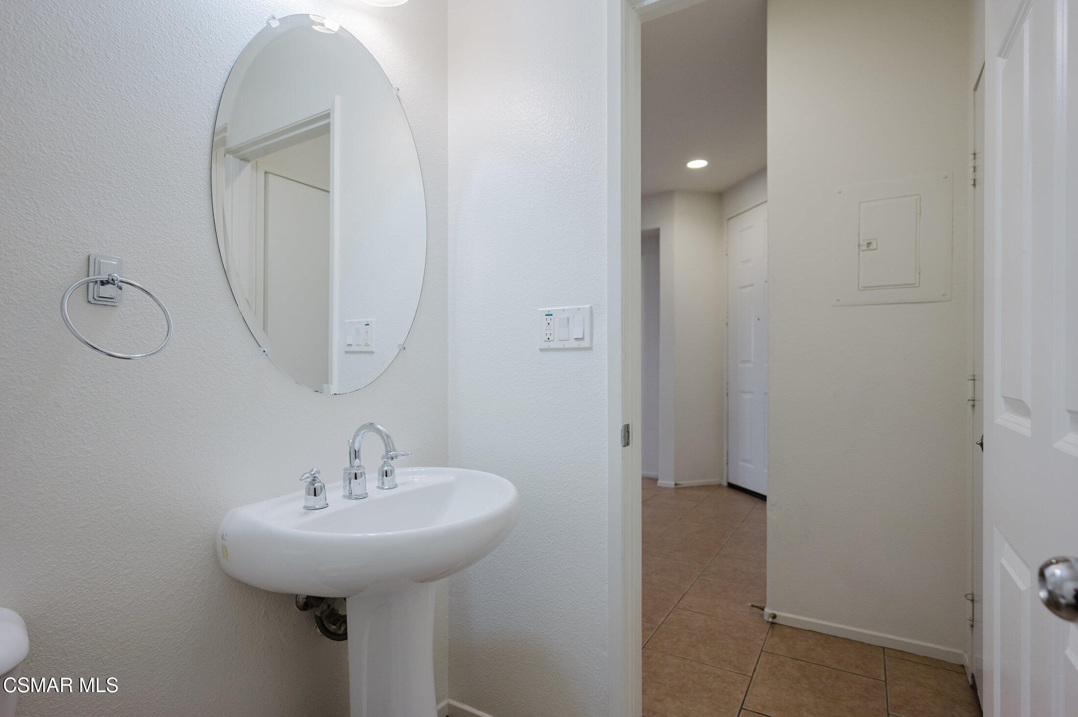 1454 Patricia Avenue, Unit 402 Simi Valley, CA 93065 - Photo 17 of 50 a bathroom with a sink and a mirror