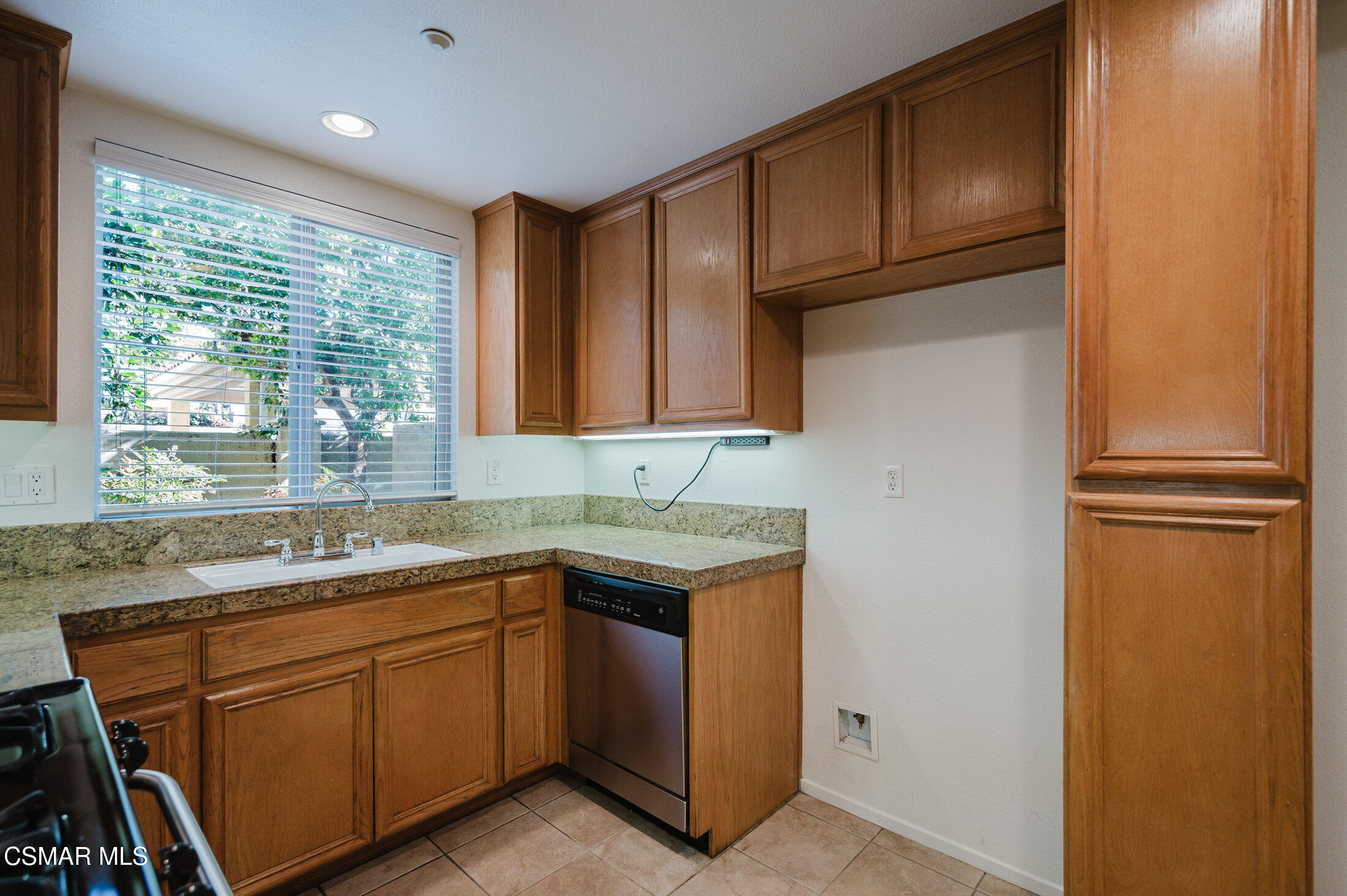1454 Patricia Avenue, Unit 402 Simi Valley, CA 93065 - Photo 20 of 50 a kitchen with a sink refrigerator and window