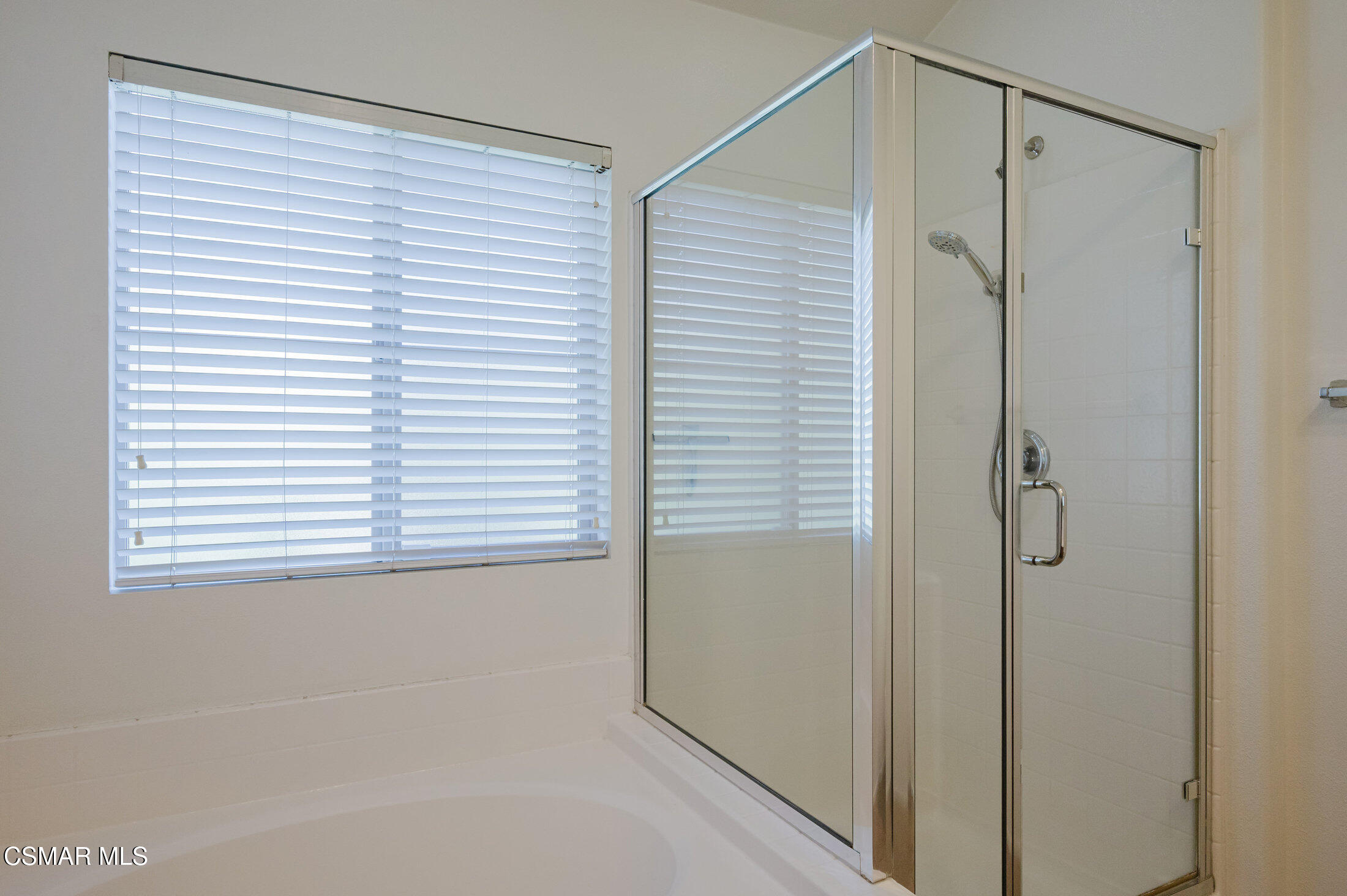 1454 Patricia Avenue, Unit 402 Simi Valley, CA 93065 - Photo 33 of 50 a bathroom with a shower and a window