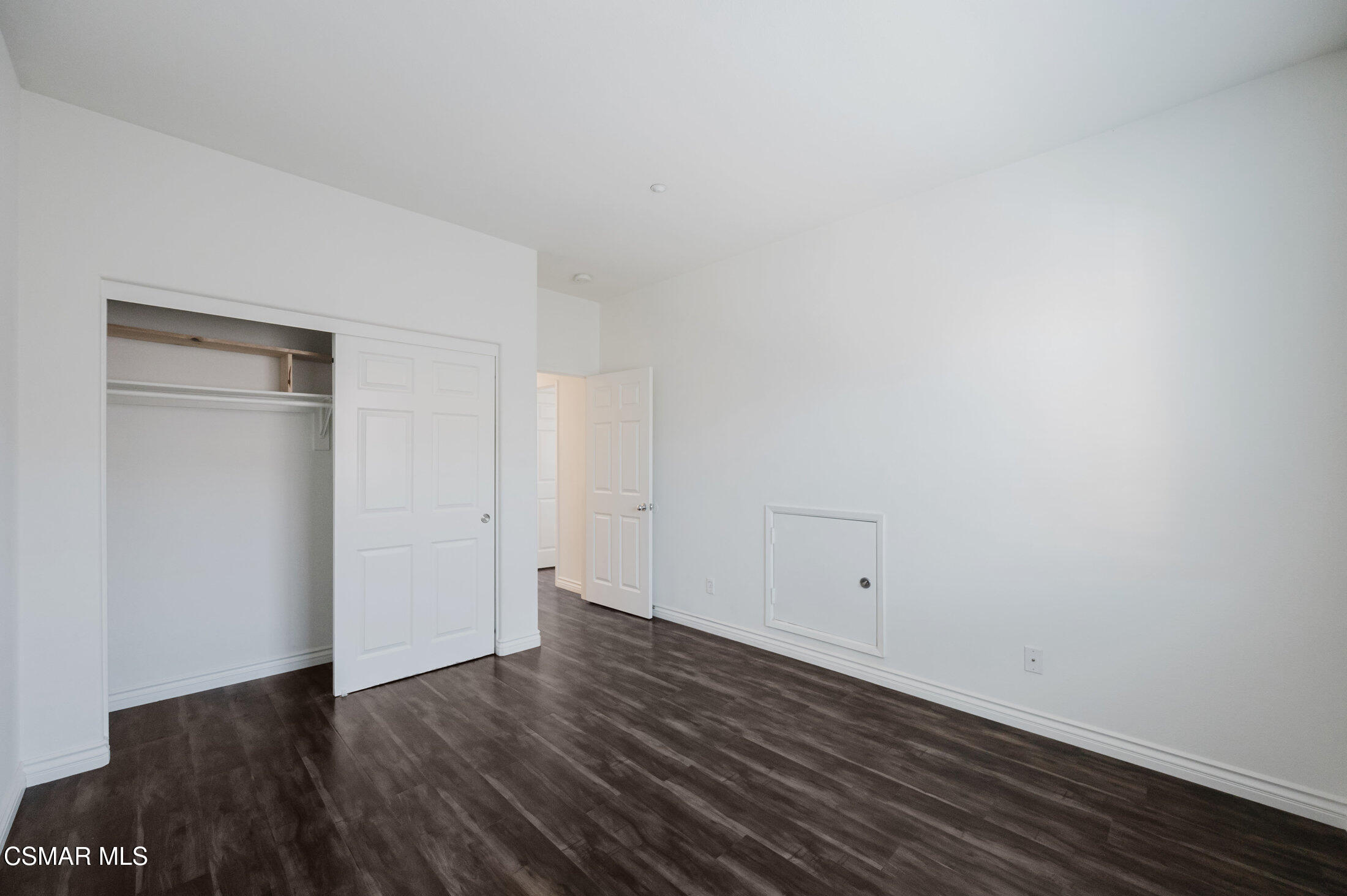1454 Patricia Avenue, Unit 402 Simi Valley, CA 93065 - Photo 44 of 50 a view of an empty room with wooden floor