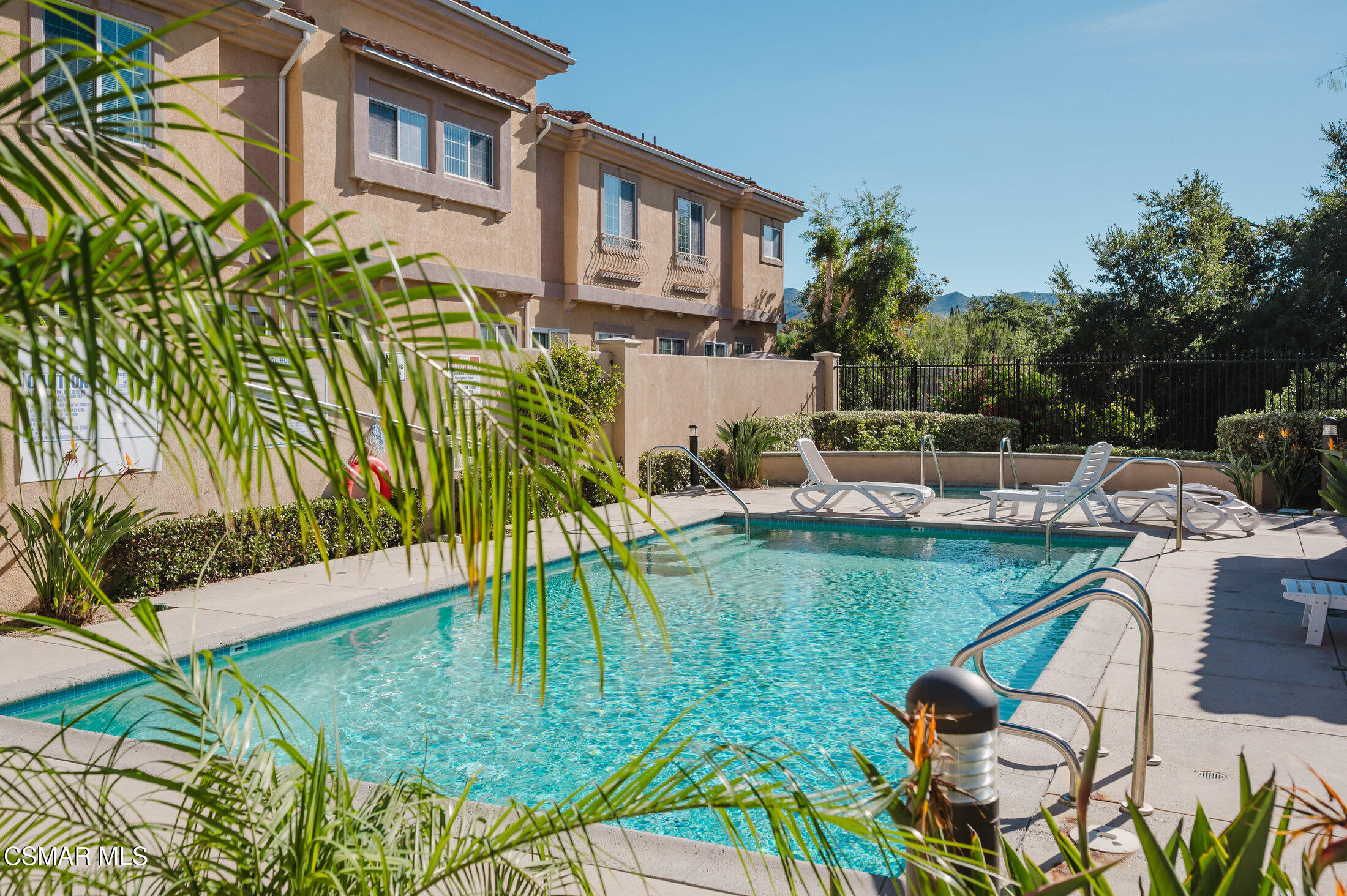 1454 Patricia Avenue, Unit 402 Simi Valley, CA 93065 - Photo 49 of 50 a view of a swimming pool with a patio