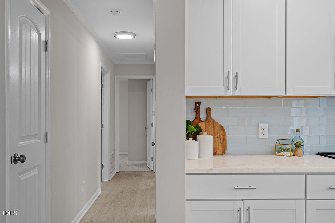 3904 Ingram Drive Raleigh, NC 27604 - Photo 15 of 37 a kitchen with a sink and cabinets