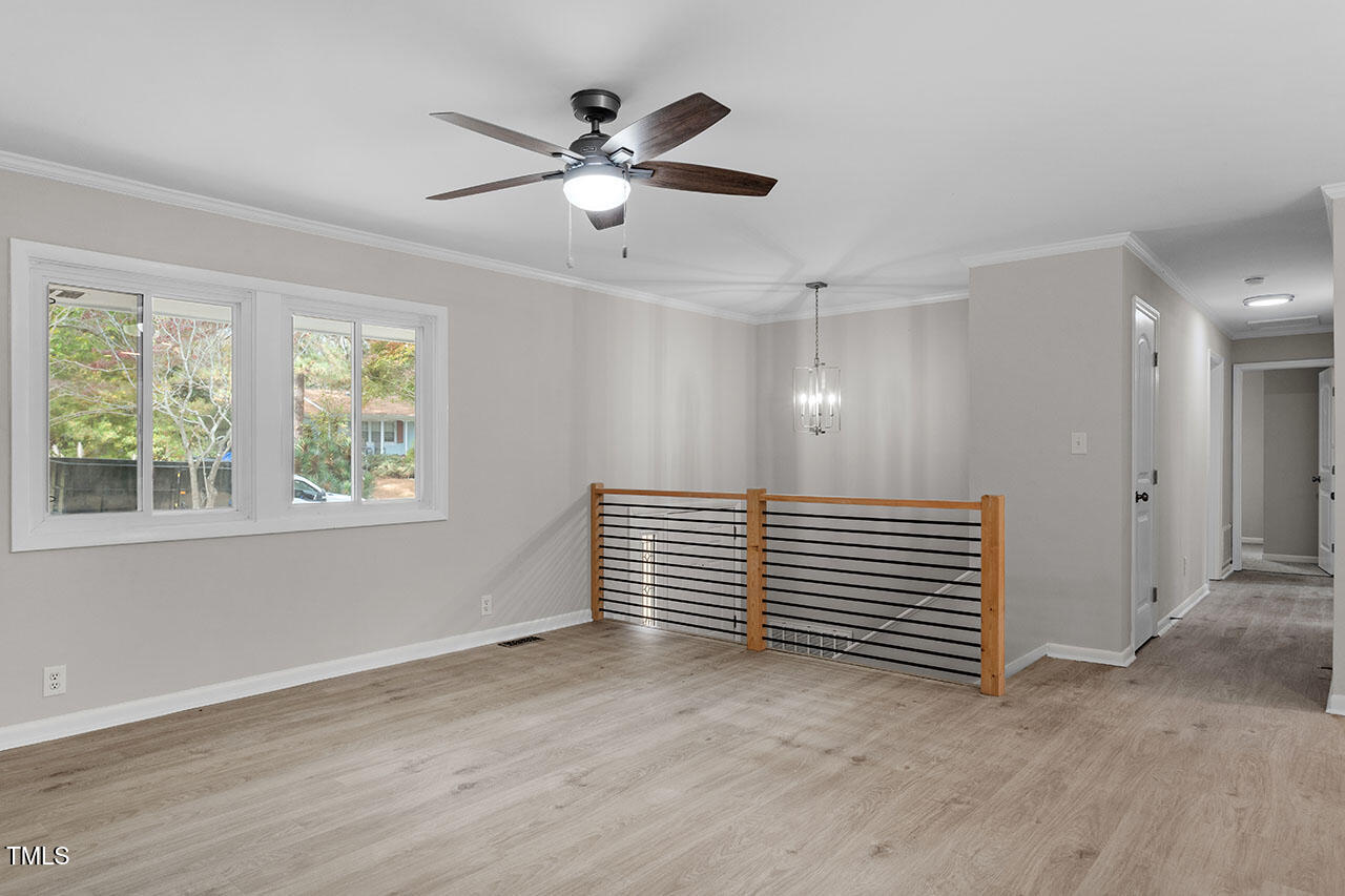 3904 Ingram Drive Raleigh, NC 27604 - Photo 16 of 37 wooden floor in an empty room with a window