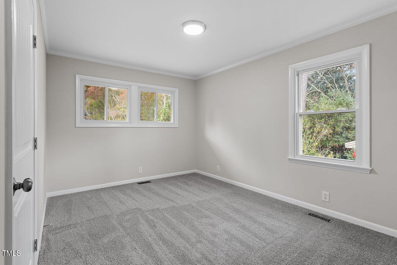3904 Ingram Drive Raleigh, NC 27604 - Photo 18 of 37 an empty room with windows
