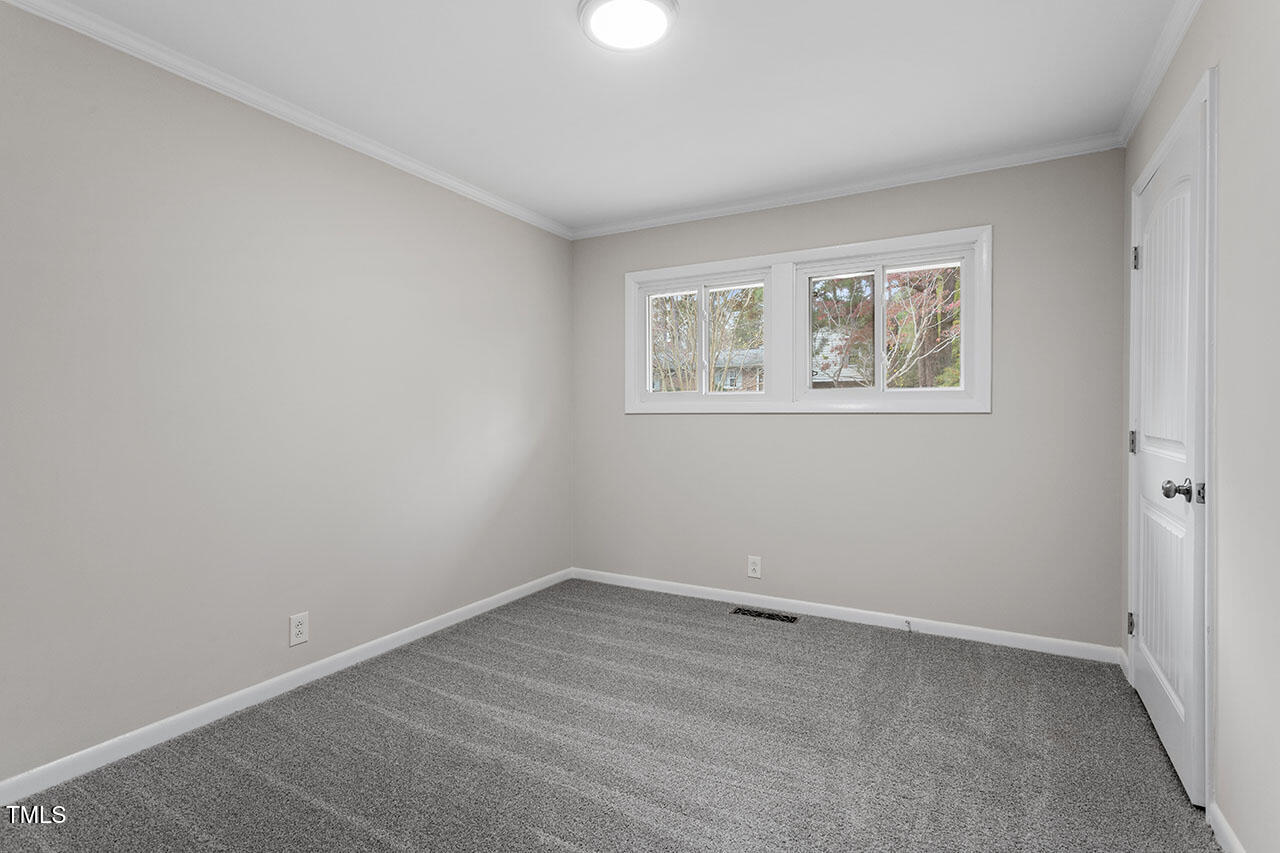 3904 Ingram Drive Raleigh, NC 27604 - Photo 19 of 37 an empty room with a window