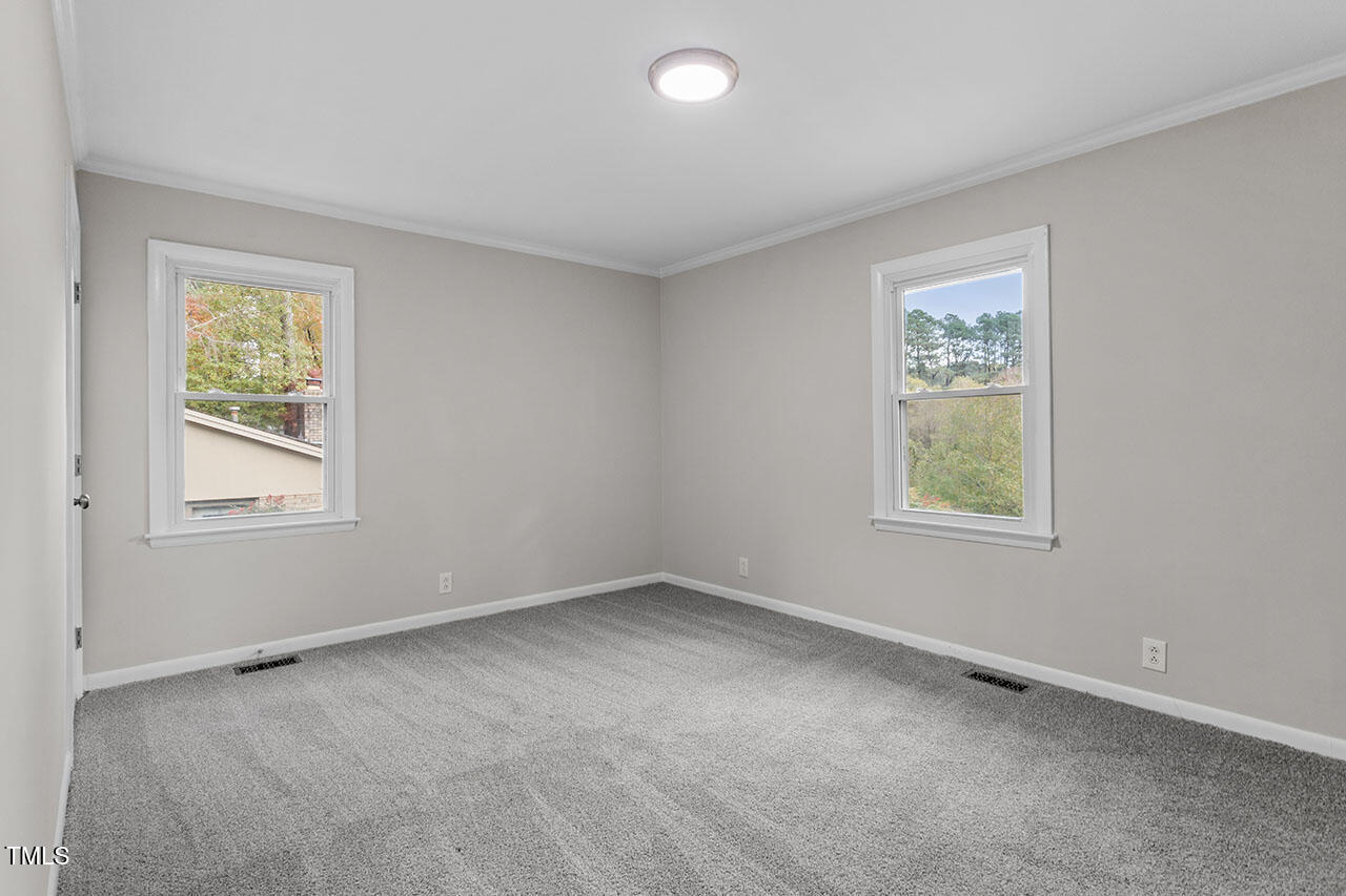 3904 Ingram Drive Raleigh, NC 27604 - Photo 20 of 37 an empty room with windows