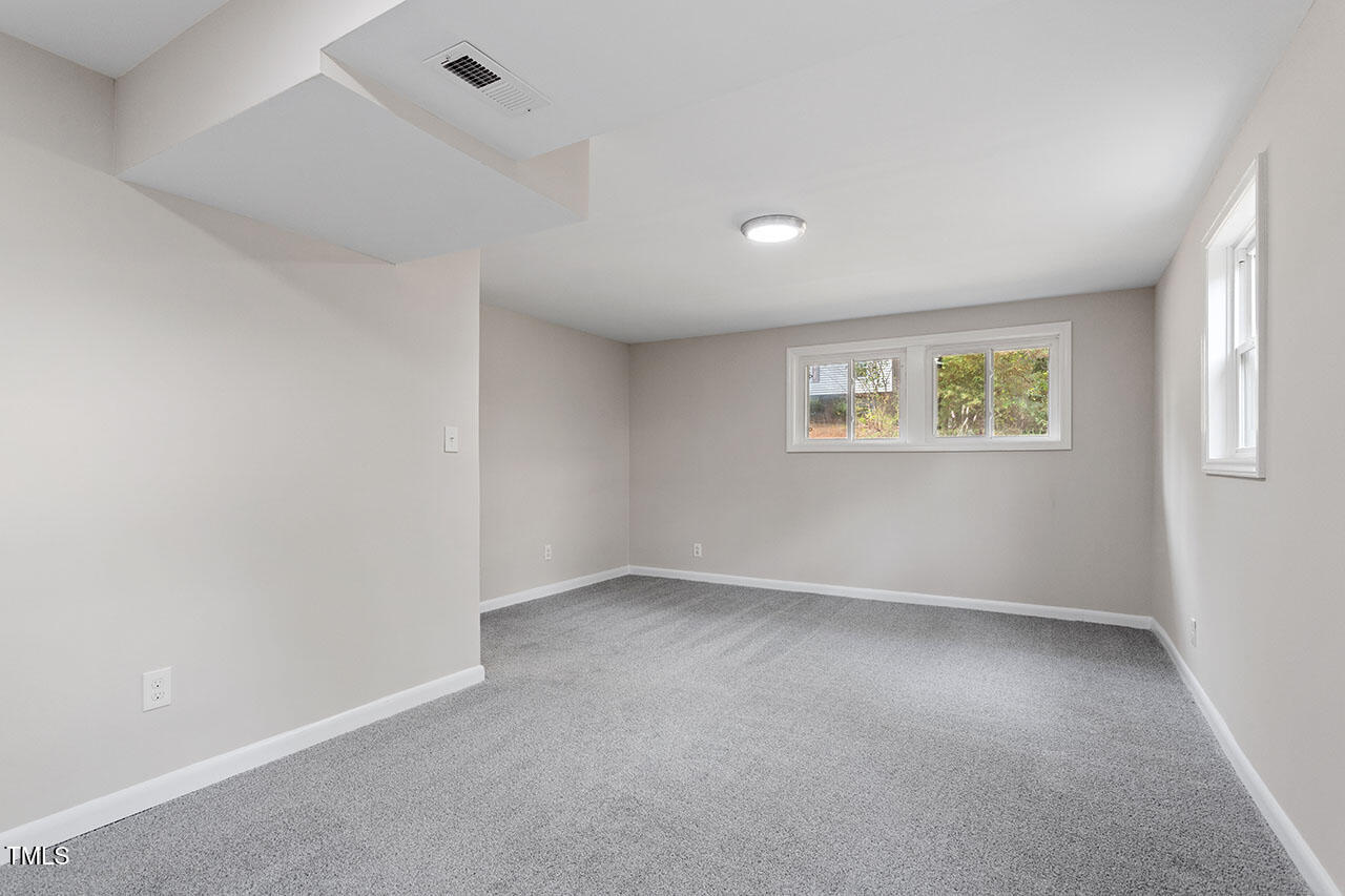 3904 Ingram Drive Raleigh, NC 27604 - Photo 21 of 37 an empty room with a window