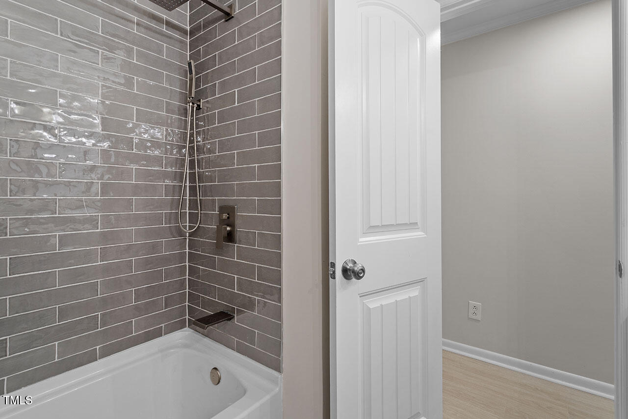 3904 Ingram Drive Raleigh, NC 27604 - Photo 26 of 37 a bathroom with a bathtub