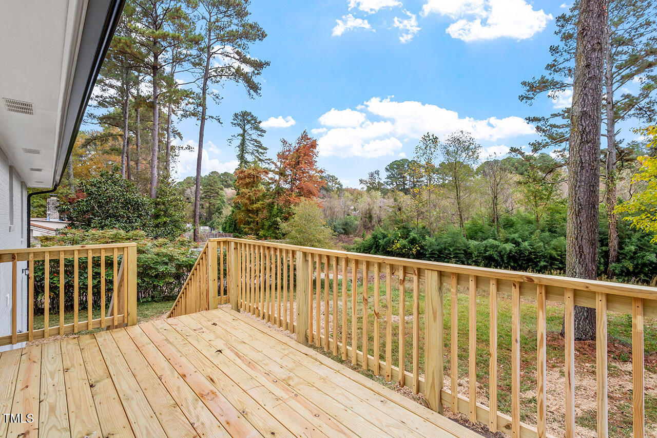 3904 Ingram Drive Raleigh, NC 27604 - Photo 35 of 37 a view of balcony with wooden floor and fence