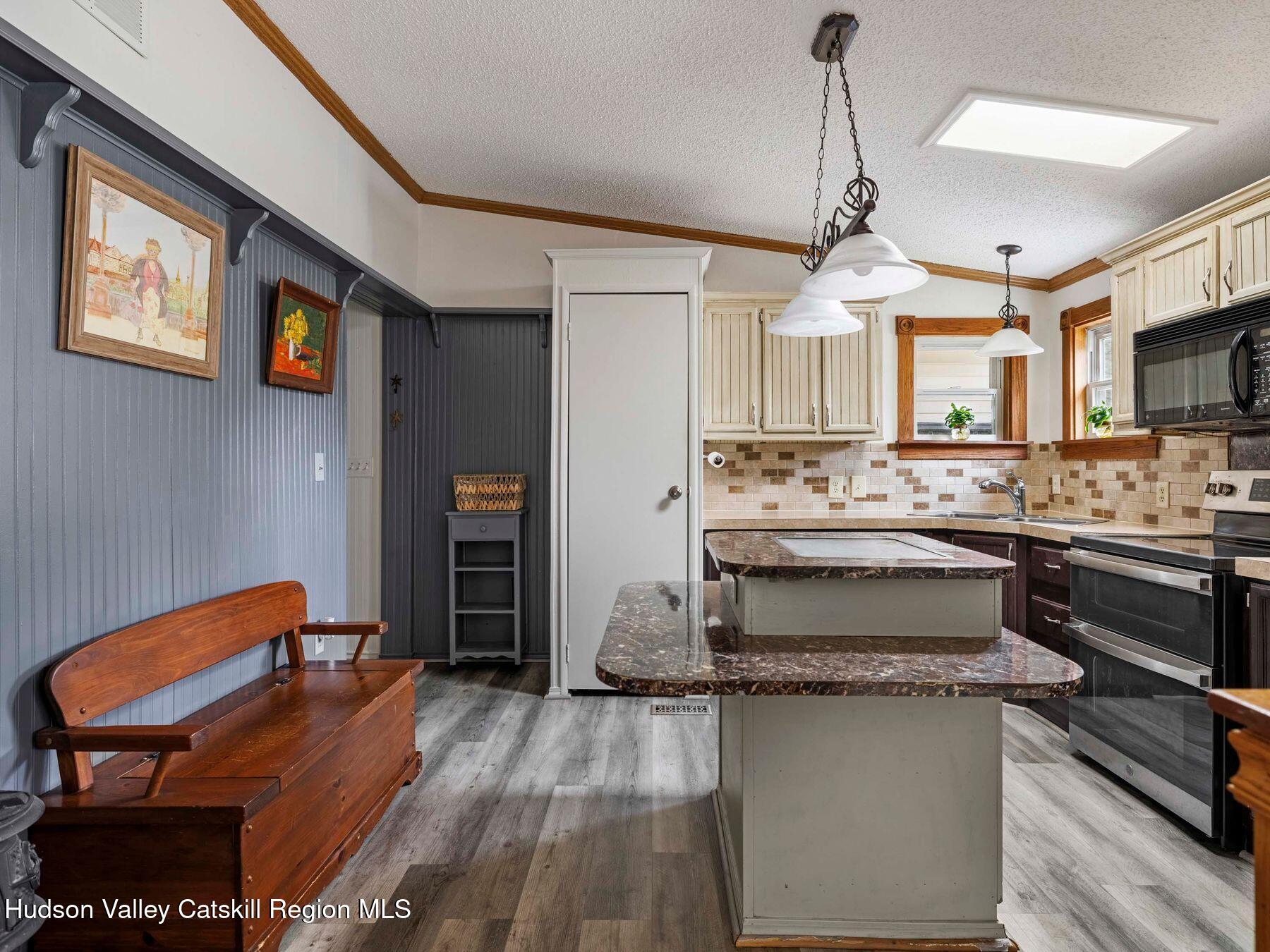 382 Cairo Junction Road Catskill, NY 12414 - Photo 13 of 38 a kitchen with a refrigerator and a stove top oven