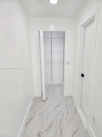 a kitchen with granite countertop a sink and a stove