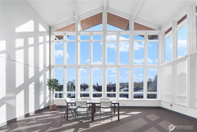 a wooden bench sitting in front of a building