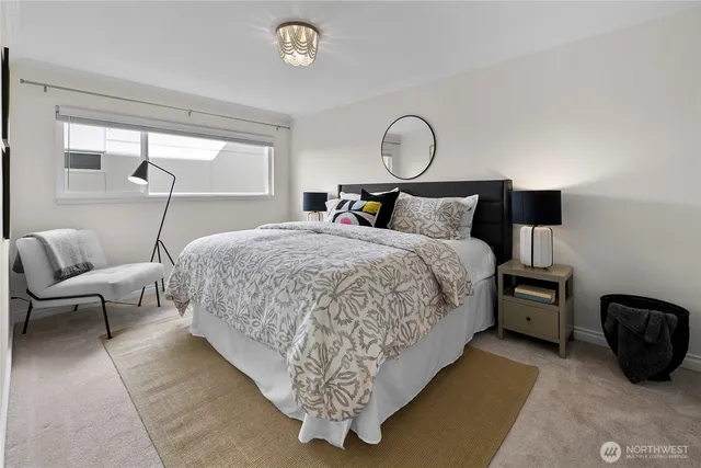 a bed room with a bed and lamp