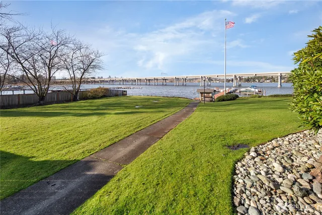 a view of a water fountain and a big yard