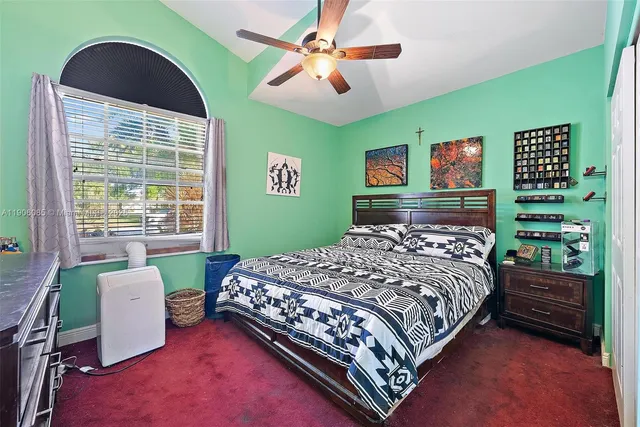 a bedroom with a bed and a table