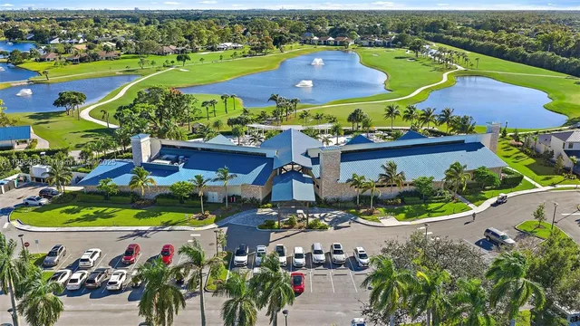 an aerial view of a houses with a garden