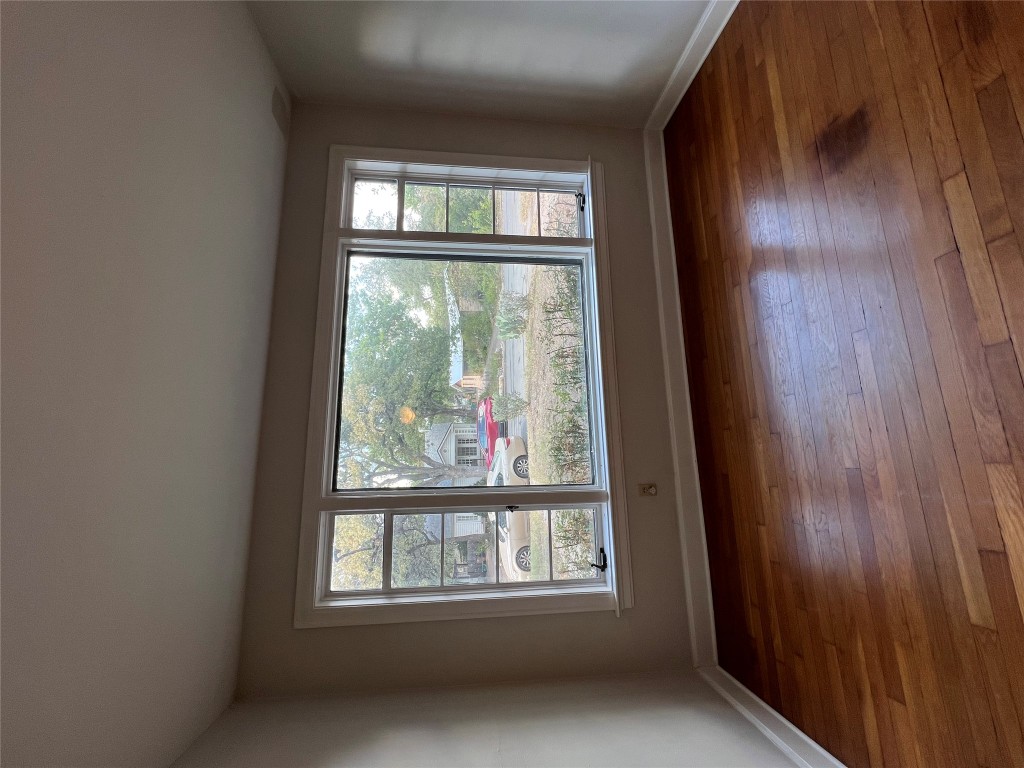 3009 French Place Austin, TX 78722 - Photo 18 of 27 a view of an empty room with wooden floor and a window