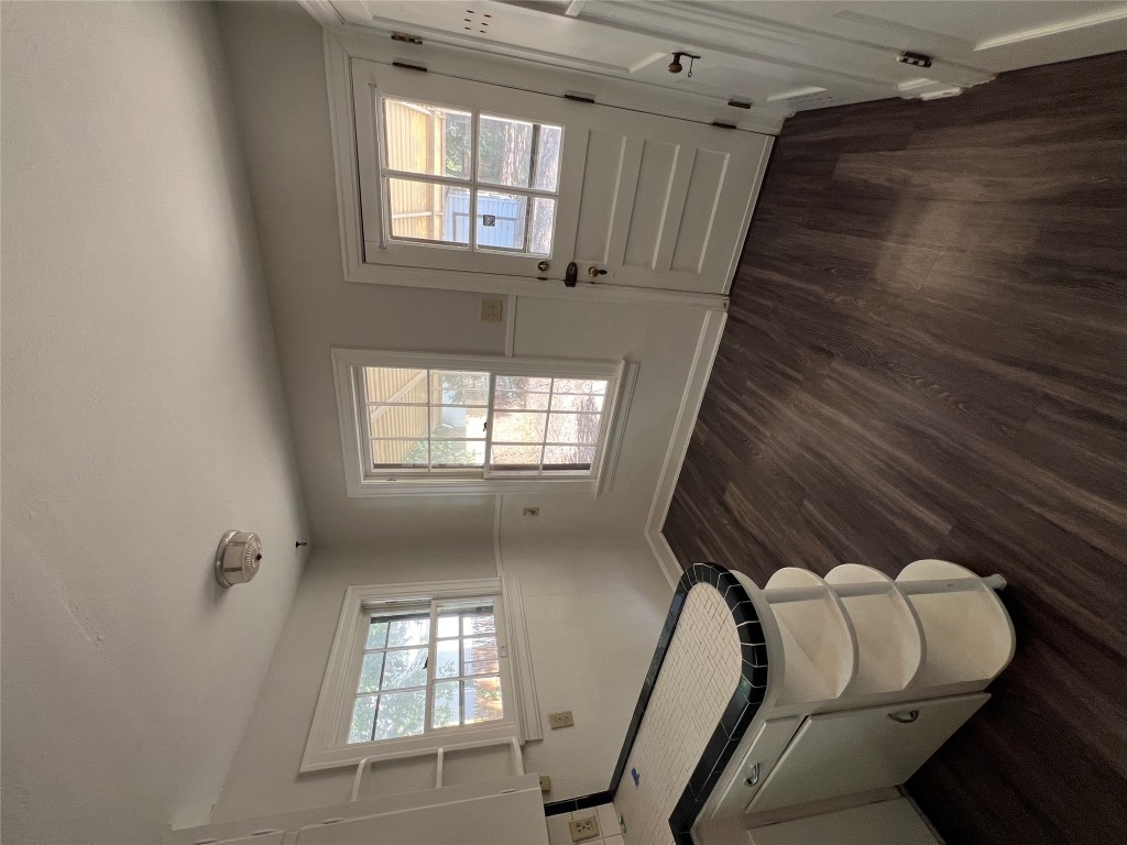 3009 French Place Austin, TX 78722 - Photo 23 of 27 a room with wooden floors and white walls