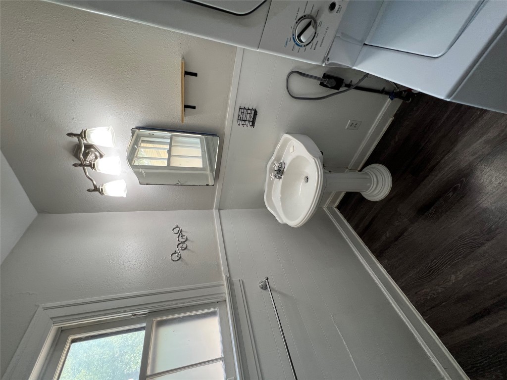 3009 French Place Austin, TX 78722 - Photo 24 of 27 a bathroom with a sink and a mirror