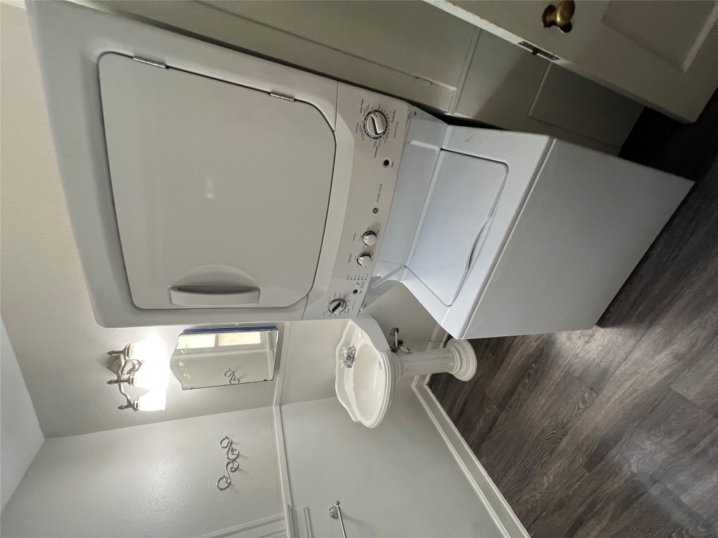 3009 French Place Austin, TX 78722 - Photo 25 of 27 a bathroom with a toilet sink and mirror