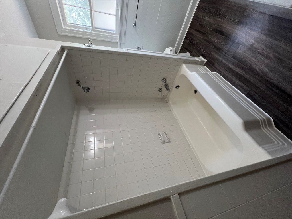 3009 French Place Austin, TX 78722 - Photo 26 of 27 a bathroom with a bathtub and shower