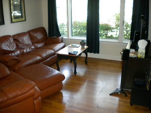 3009 French Place Austin, TX 78722 - Photo 7 of 27 a living room with furniture and a floor to ceiling window