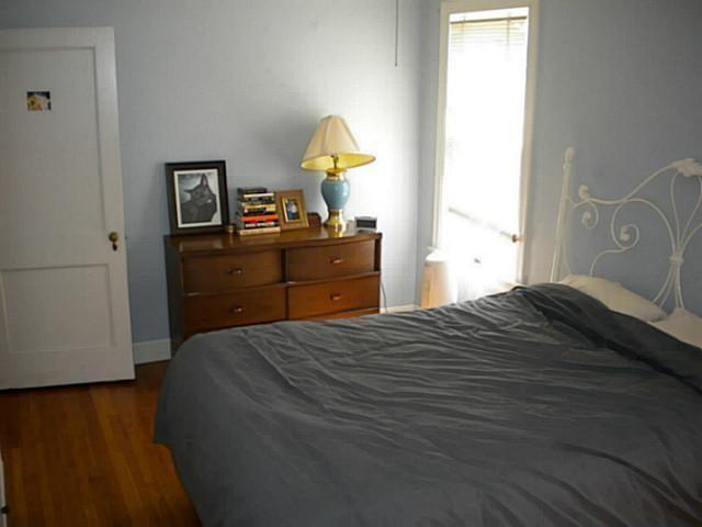 3009 French Place Austin, TX 78722 - Photo 8 of 27 a bedroom with a bed and a dresser