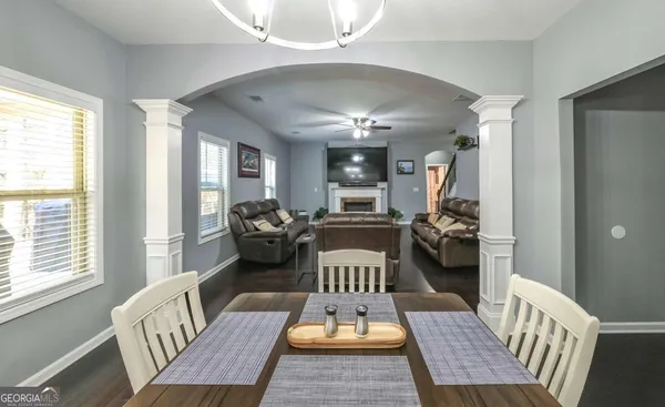 a view of a dining room with furniture window and outside view