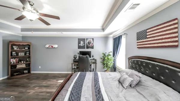 a bathroom with a granite countertop tub sink and mirror