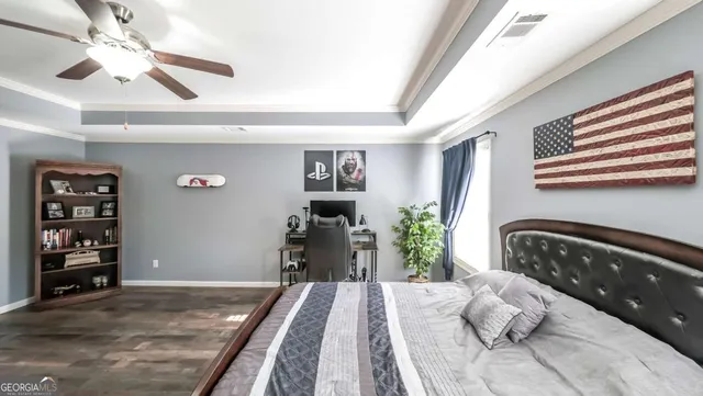 a bathroom with a granite countertop tub sink and mirror