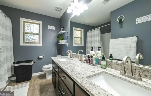 a bedroom with a bed and a tv