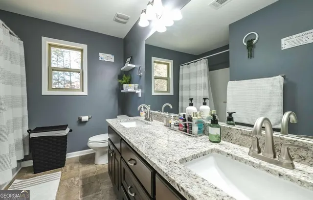 a bedroom with a bed and a tv