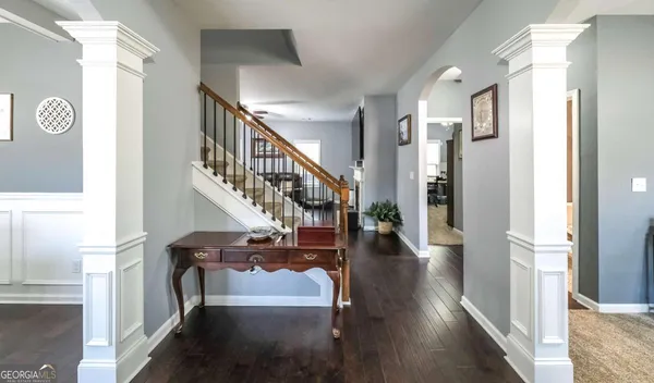 a view of a dining room with furniture window and wooden floor
