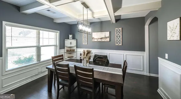 a view of a dining room with furniture window and wooden floor