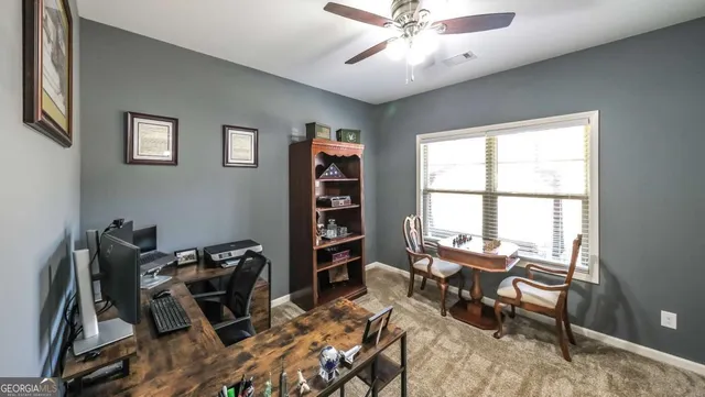 a workspace with furniture and a window