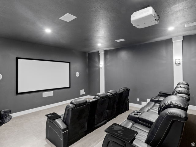 614 East High Lane Alpine, UT 84004 - Photo 47 of 75 Cinema room with light colored carpet and a textured ceiling