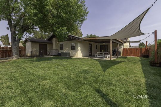 815 James Street Ridgecrest, CA 93555 - Photo 24 of 27 a view of a house with a yard porch and sitting area