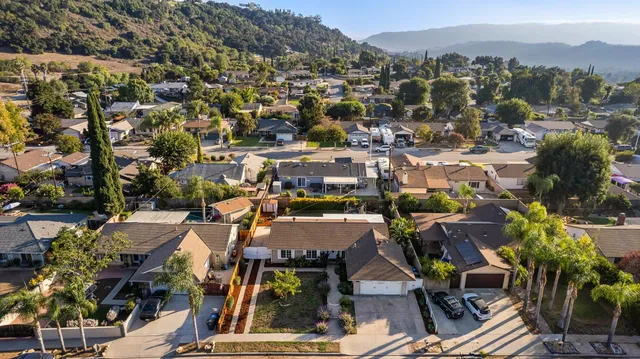 an aerial view of residential house with outdoor space