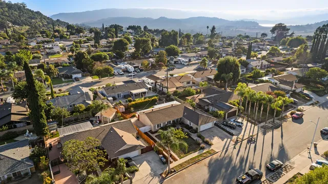 an aerial view of a house with swimming pool