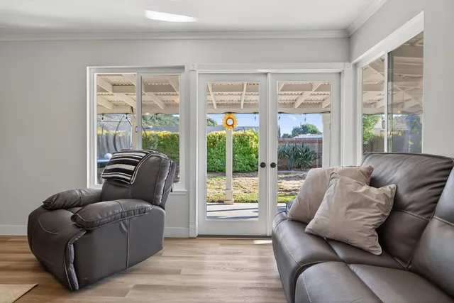 a living room with furniture and windows