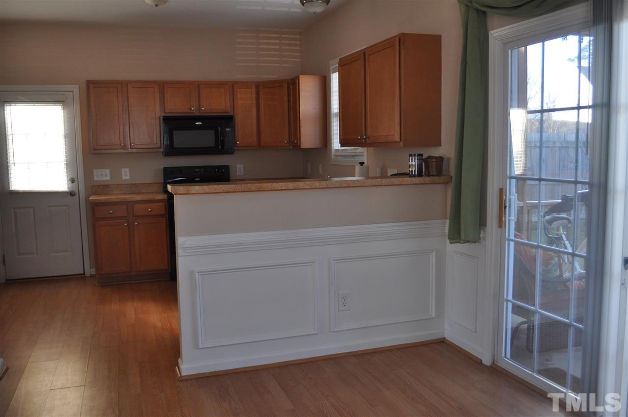 4010 Alder Grove Lane Raleigh, NC 27610 - Photo 7 of 20 Open kitchen with breakfast bar