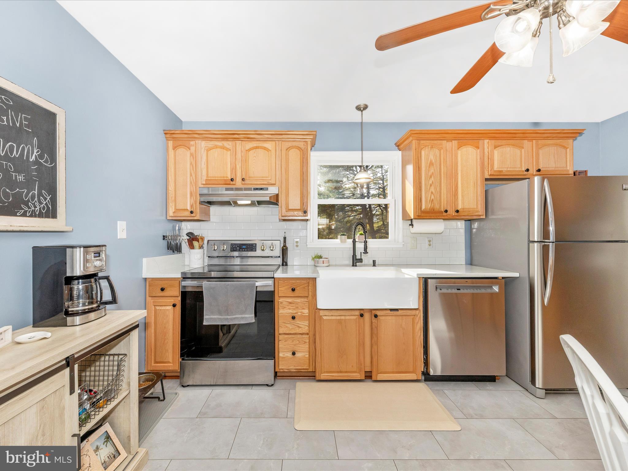 8829 Orndorff Road Thurmont, MD 21788 - Photo 12 of 46 a kitchen with white cabinets and appliances