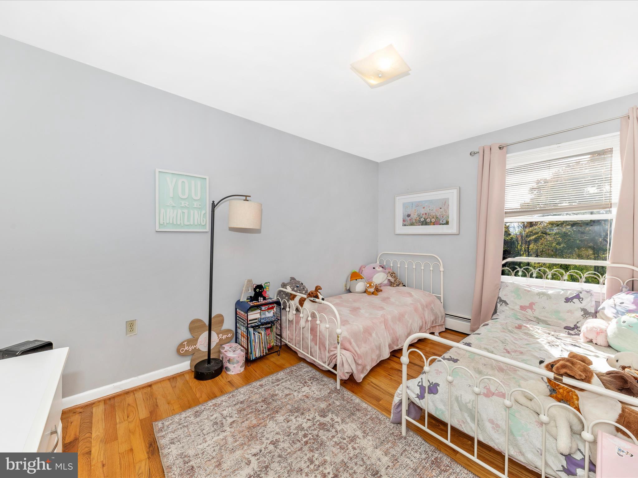 8829 Orndorff Road Thurmont, MD 21788 - Photo 19 of 46 a bed room with two bed and a window