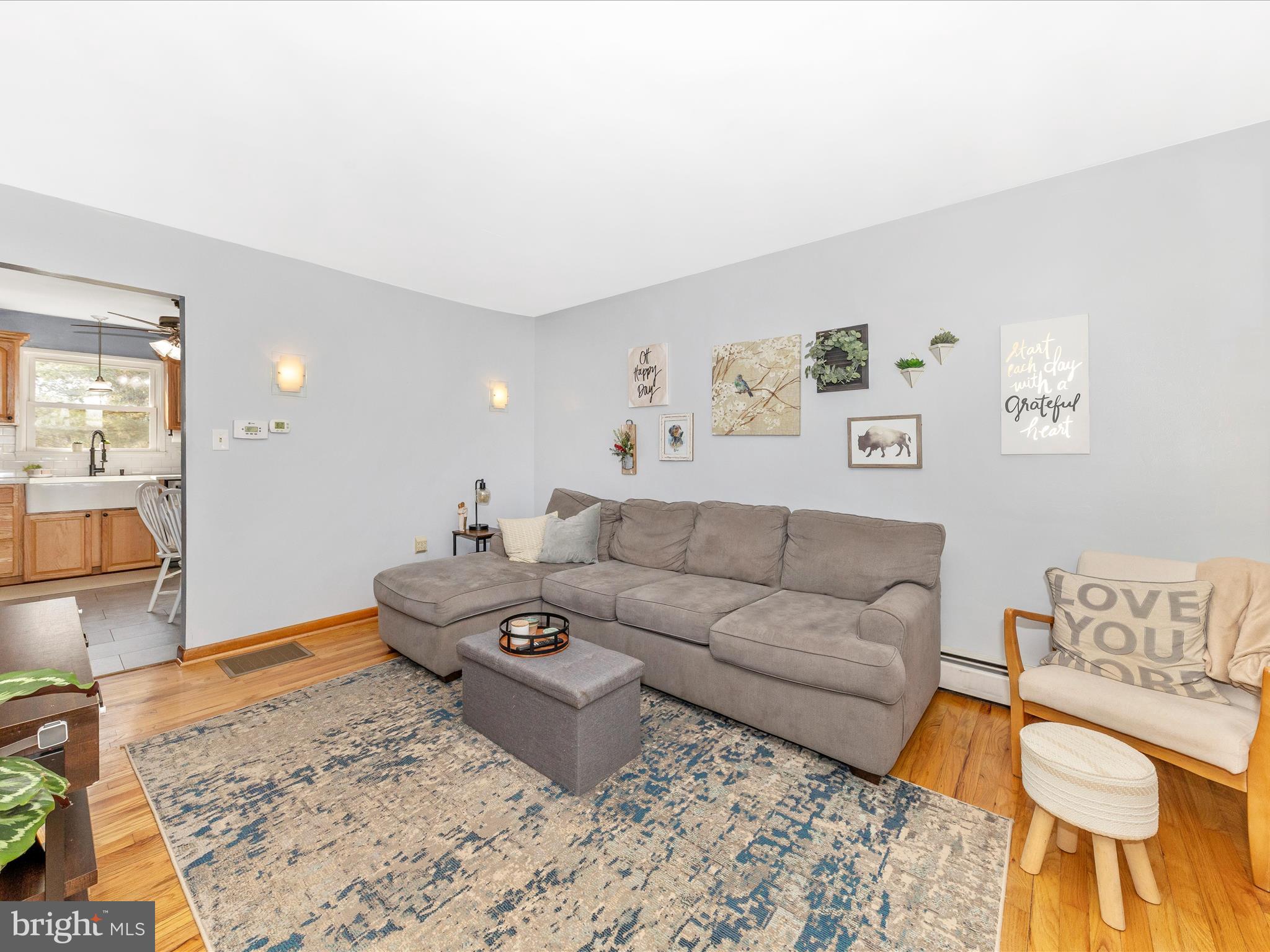 8829 Orndorff Road Thurmont, MD 21788 - Photo 3 of 46 a living room with furniture and wooden floor