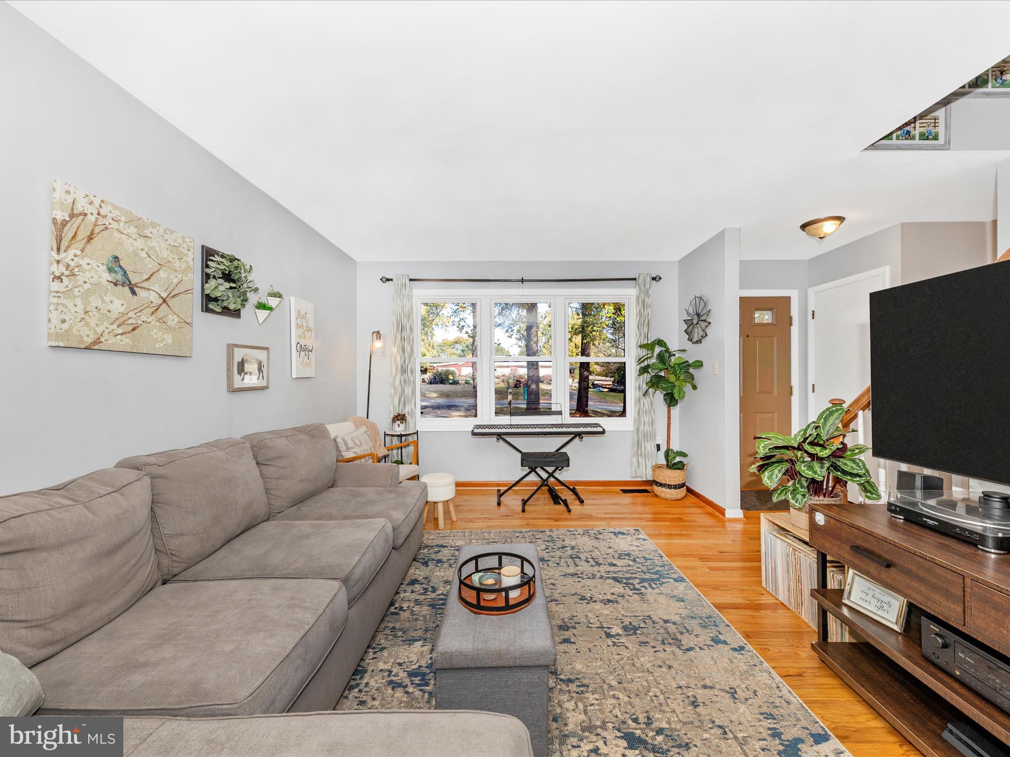 8829 Orndorff Road Thurmont, MD 21788 - Photo 6 of 46 a living room with furniture and a flat screen tv