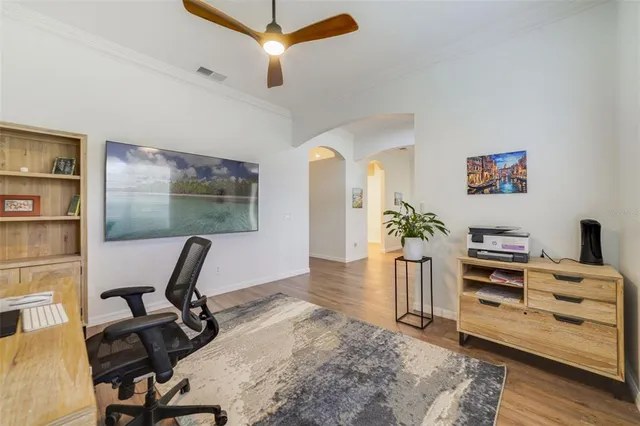 a view of a workspace with furniture and a potted plant