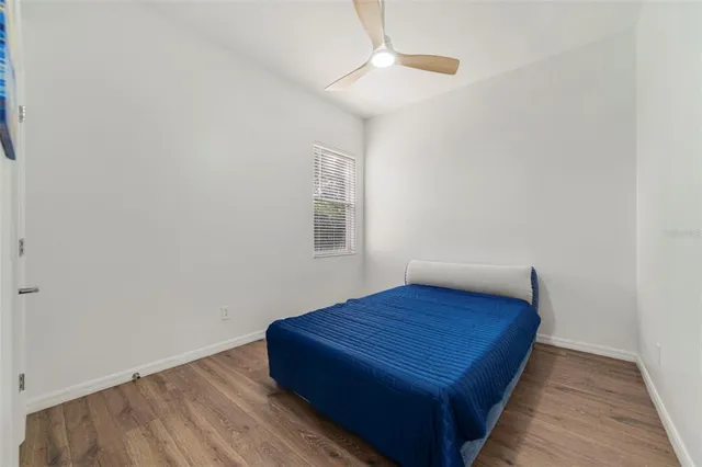 a view of room with window and wooden floor
